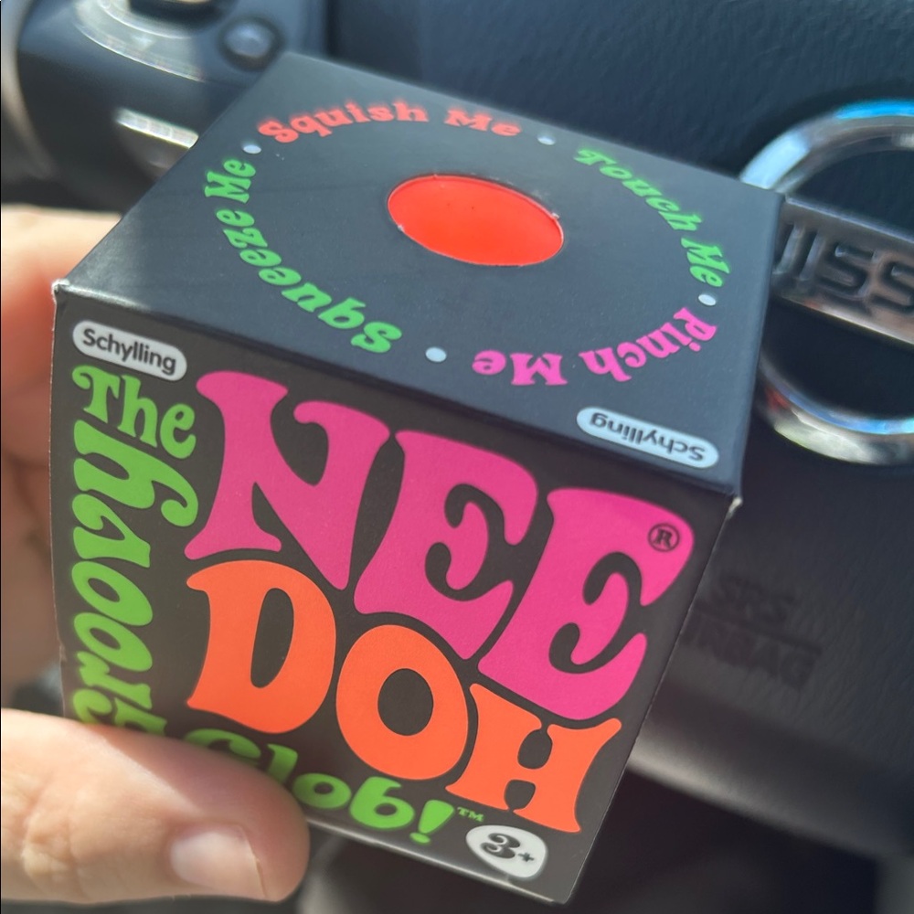 The NeeDoh Groovy Glow Stress Ball Box - Bright Orange
